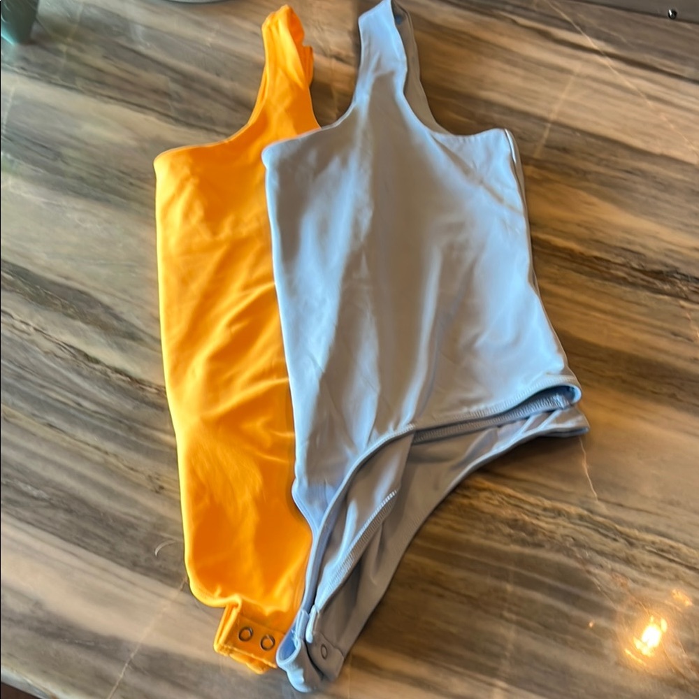 Express Glacier Blue and Yellow Bodysuit with Dynamic Color Blocking